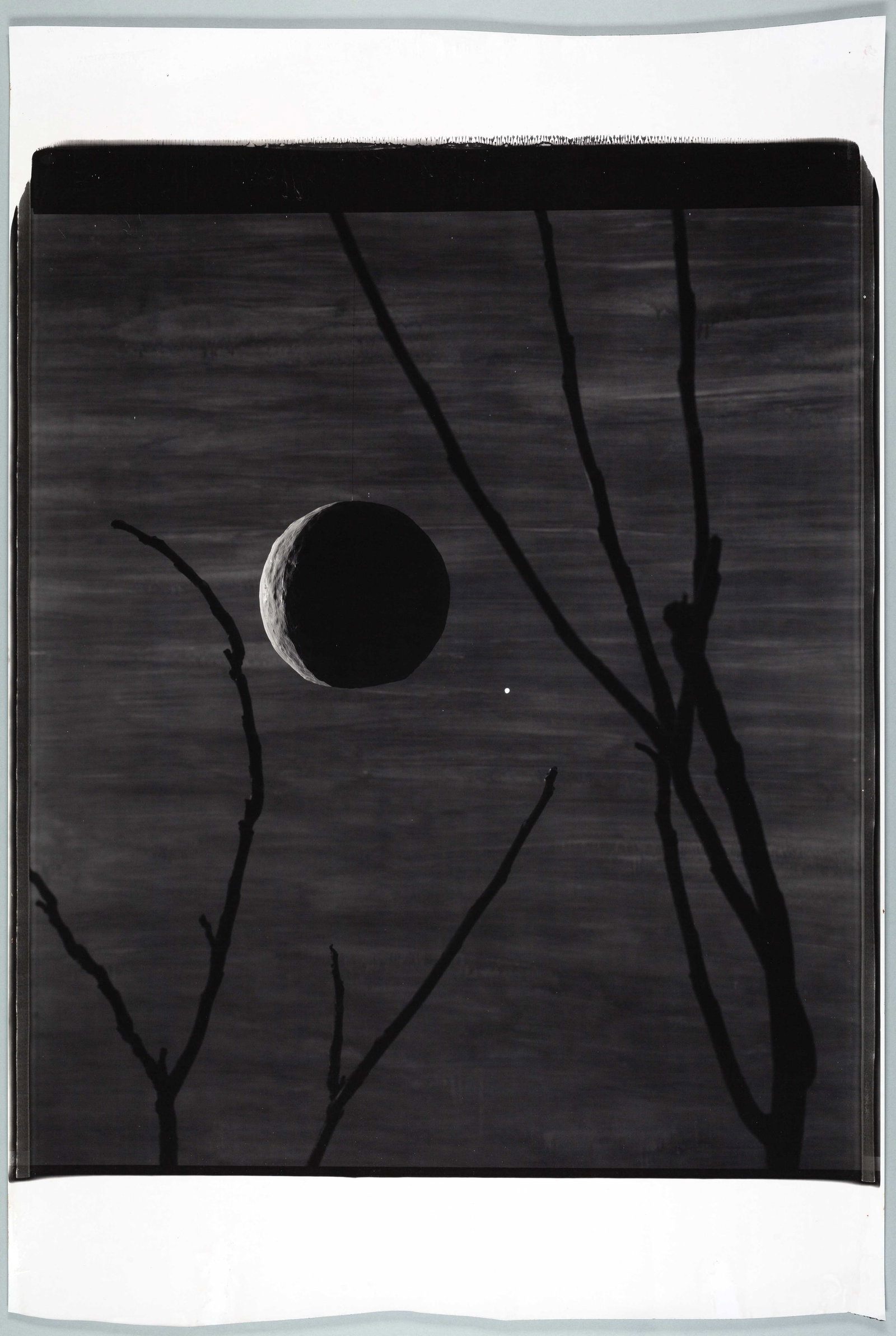 JOHN DIVOLA (*1949): JOHN DIVOLA (*1949) | 'Moon #5', New York 1988 Image Size: c. 62 x 53 cm English Unique Polaroid PolaPan 20x24 inch, c. 83 x 56 cm, in excellent condition. Signed and dated with copyright note as