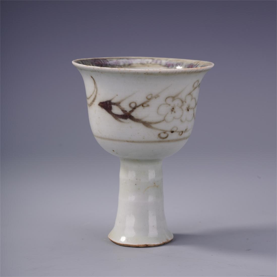 CHINESE PORCELAIN RED UNDER GLAZE STEM CUP MING DYNASTY: CHINESE PORCELAIN RED UNDER GLAZE STEM CUP MING DYNASTY. H. 11.5 cm. Shipping cost $30 to any USA 48 states and $100 oversea shipping. Our package processing time range is 2wk to 4wk. Items to some As