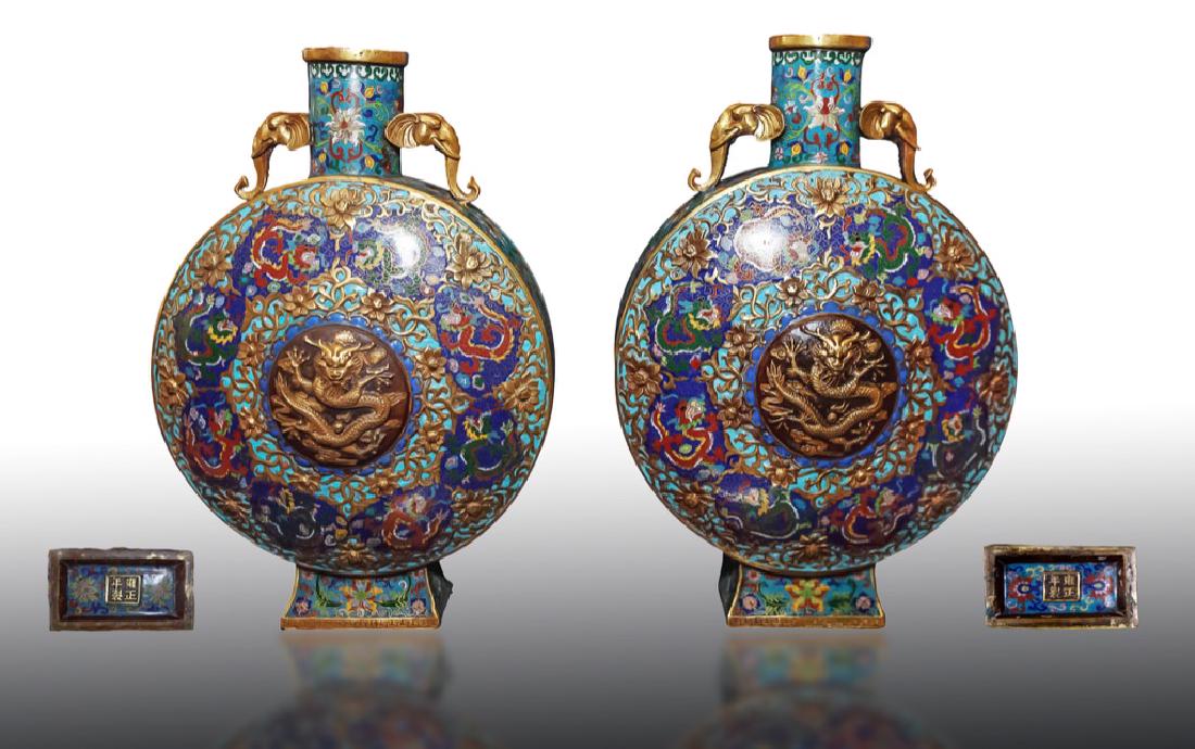 Important Large Qing Dynasty Pair of Chinese Cloisonne: Qing Dynasty Pair of Chinese cloisonne moon flasks, featuring a dragon roundel encircled by eight meandering dragons on a blue ground and accented with flowers, base with apocryphal Yongzheng mark, Ap