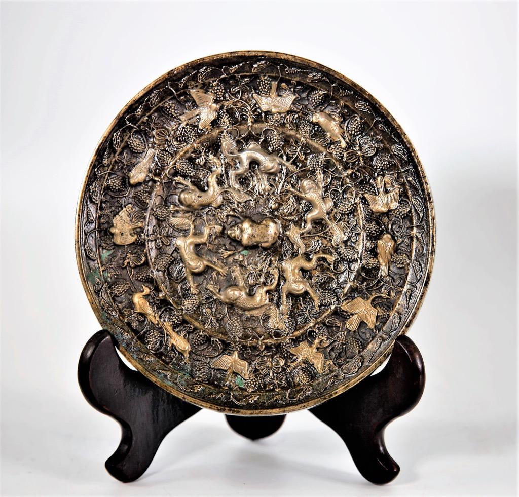 Chinese circular archaistic metal mirror (1 of 2)