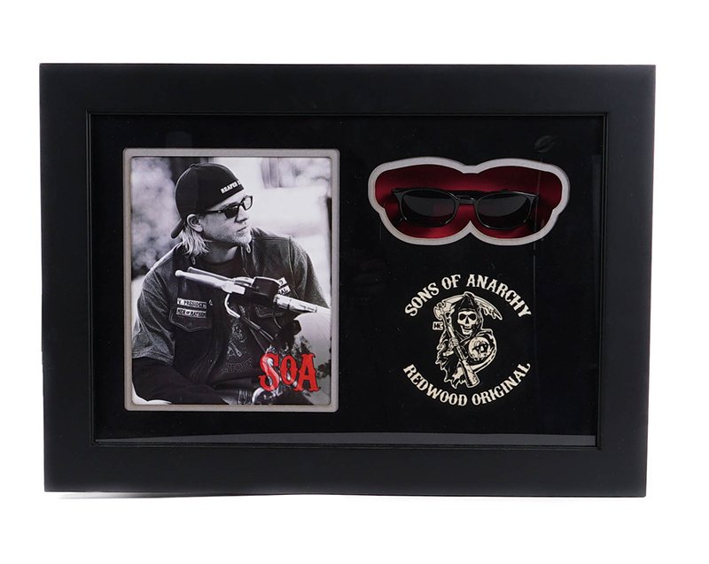 Sons of Anarchy Jax Glasses Display: Sunglasses worn by actor Charlie Hunnam as Jackson 'Jax' Teller in the FX crime drama television series Sons of Anarchy that aired from 2008 to 2014. Jax was a member of the Sons of Anarchy motorcycle