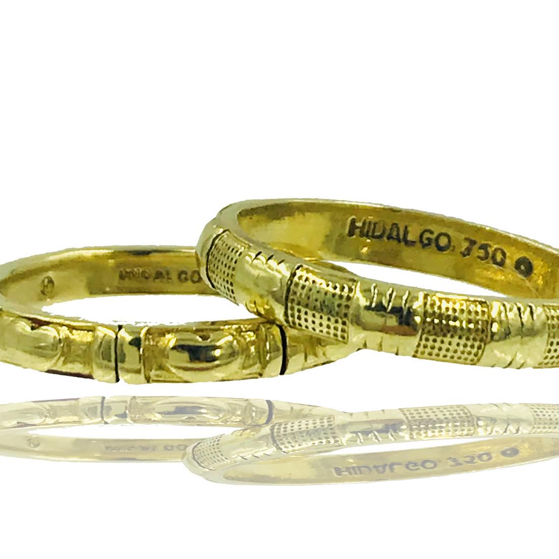 18 Karat yellow gold, Hildalgo Designer Stackable Rings: Retail: $2500 Set of Hildalgo Designer, Stackable rings designed with hearts and rectangular, etched designing. Size 6 and 18 karat Yellow gold the Bands are 3 millimeters in width. The metal is 7.7 g