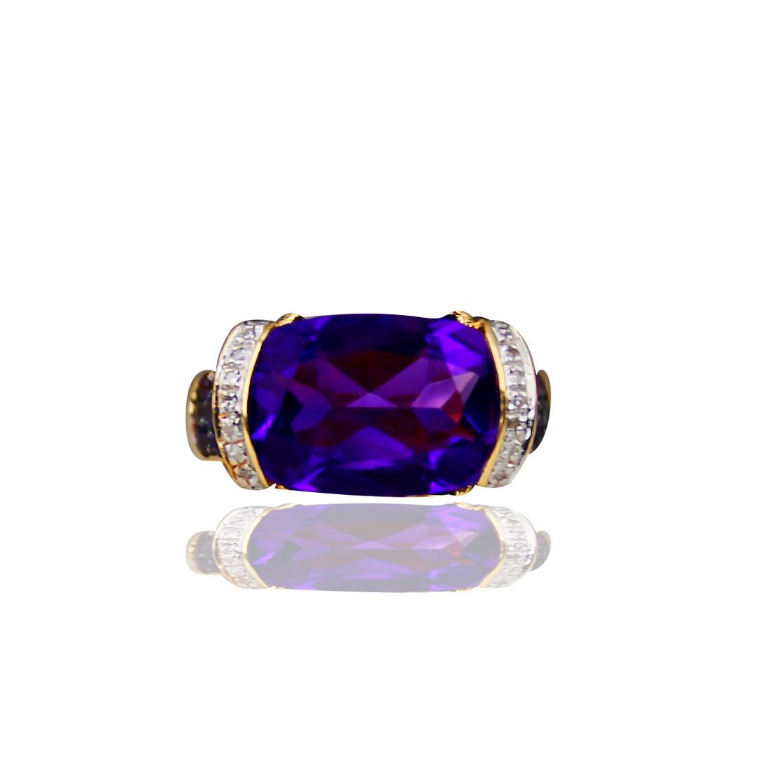 6 Carat Ring with Amethyst, Pink Sapphire Featuring: Retail: $4200 14 karat yellow gold, Amethyst ring with Pink Sapphire with a signature, Flower Design on sides. The ring top supports a large cushion cut Amethyst, Brazilian color and measuring 13 x 10