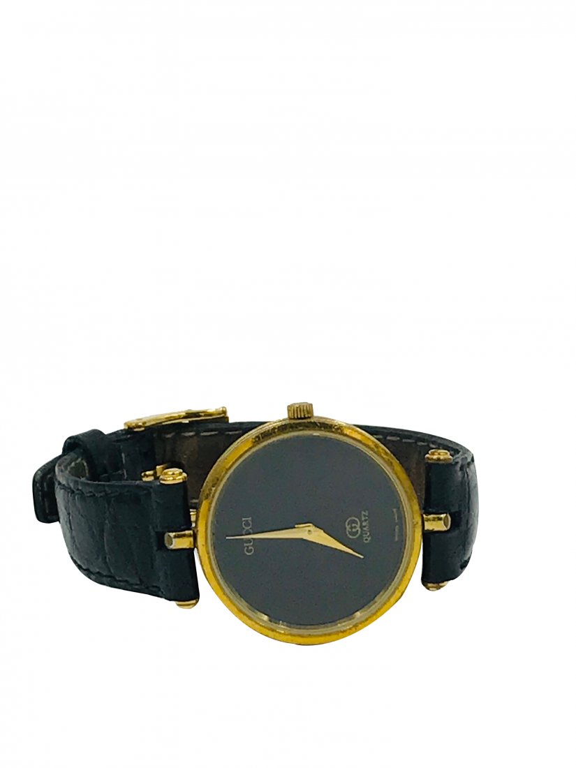 Gucci, Quartz Black Dial 30 mm Watch, Black Strap: Gucci, Quartz Black Dial 30 mm Watch, Black Strap Original Gucci with gold hands and black dial. Watch has colored side casing, consistent with Gucci style Comes with a fresh battery 8 inch length GIA