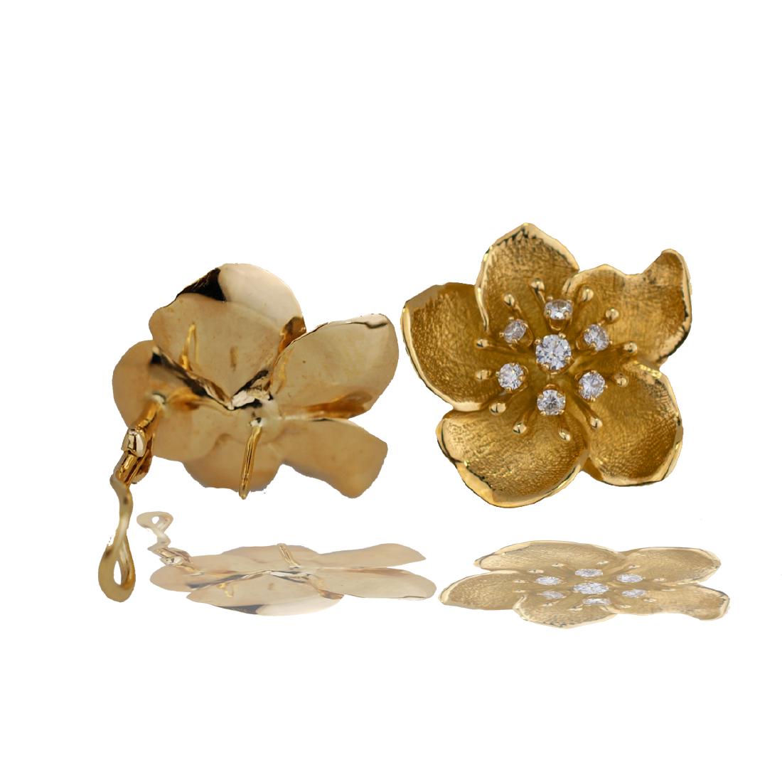 Floral, Hallmarked .70 Carat Diamond 18 Karat Yellow: Floral, Hallmarked Diamond 18 Karat Yellow Earrings Hallmark is a heart and arrow. Heavy 14.6 grams of solid gold feature (14) cluster round diamonds 2.20 mm -2.70 mm. Total weight of the diamond is e