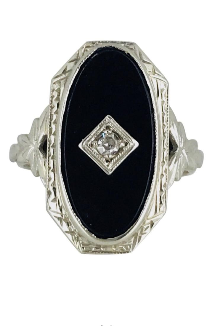 Victorian Diamond & Black Onyx Ring, 14 Karat Gold: Retail: $595 Victorian, Black Onxy ring with a single cut diamond in the center. The ring is a 17.94 x 10.80 millimeters in diameters with a smooth black onyx inset. Diamond is a single cut measuring