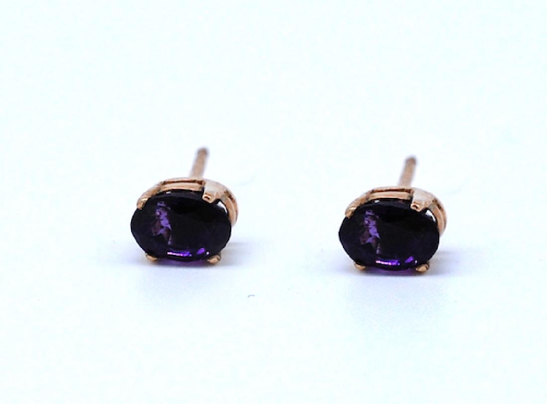 BRazilian Amethyst, 14 Kt. Gold Earrings: Brazilian Amethyst, 14 Kt. Gold Earrings Oval shaped 5x7 mm deep colored, Brazilian amethyst set ing a sturdy basket style setting GIA gemologist inspected and evaluated