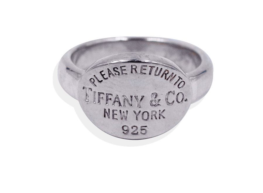 Tiffany & Co. Please Return To New York Ring, Sterling: Tiffany & Co. Please Return To New York Ring, Sterling Authentic, Tiffany & Co. ring, oval top measuring ½ inch x ¾ inches. Ring size 7-3/4 Engraved top of ring Tiffany and Co. Please return to New 