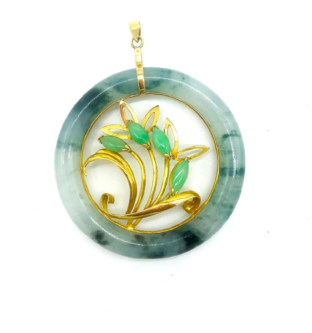 Chinese Jade, 14 kt Tree of Life, Pendant: Chinese Jade, 14 kt Tree of Life, Pendant 2 Inch diameter Jade Pendant measuring 8 mm outside band suspended on a 14 karat yellow gold pendant bail Lively floral pattern Inside is set with 4-marquise 