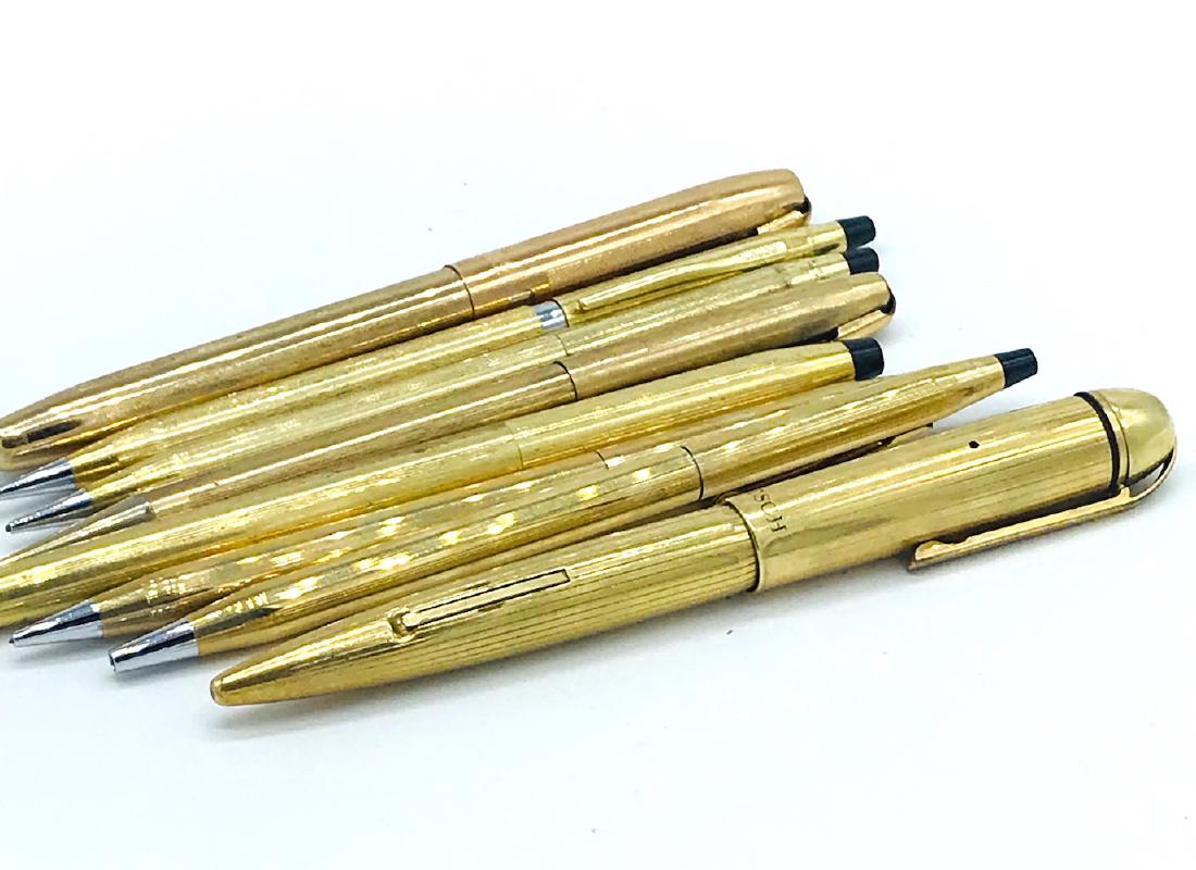 NINE, VINTAGE GOLD FILLED PENS & PENCILS. Circa 1970's: NINE, VINTAGE GOLD FILLED PENS & PENCILS CROSS BRAND AND HOLT SET INCLUDES 3- RETRACTABLE PENCILS; 4- RETRACTABLE BALL POINT PENS; 1 FOUNTAIN PEN (EVERSHARP CO), MONOGRAM DETSCH; 1 FELT MARKER. REPLAC
