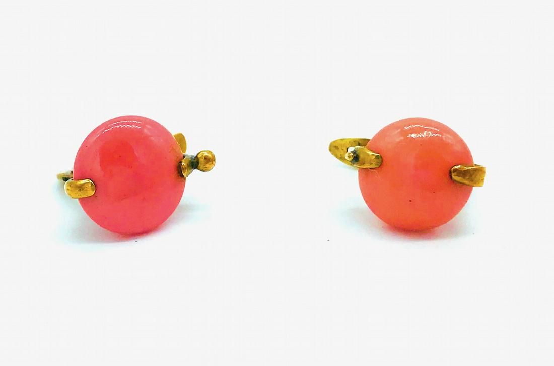 Circa 1940: Circa 1940's Coral, Hinged Earings, 14 Kt Yellow Gold Retro earrings with smooth disk coral measuring 11.30 mm wide supported by two prongs. The setting is a sturdy clip hinge for pierced earrings. We