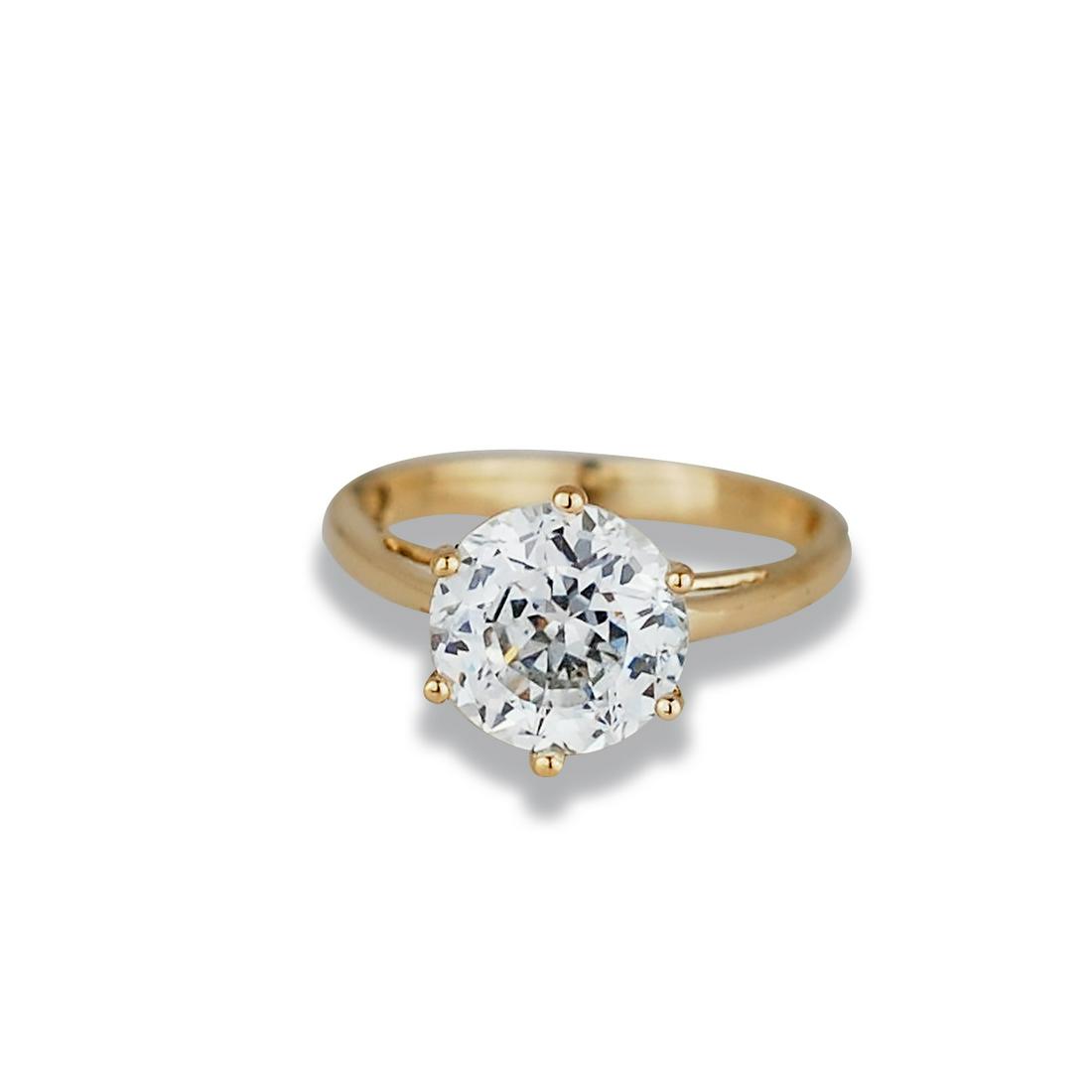 2.65 Ct Round, 14 Karat Yellow gold White Stone: 2.65 Ct Round, 14 Karat Yellow gold White Stone Engagement Ring Brilliantly set, 9 mm round man-made, believable, white stone center, set in a 6-prong quality setting. Ring measures 2 millimeters as