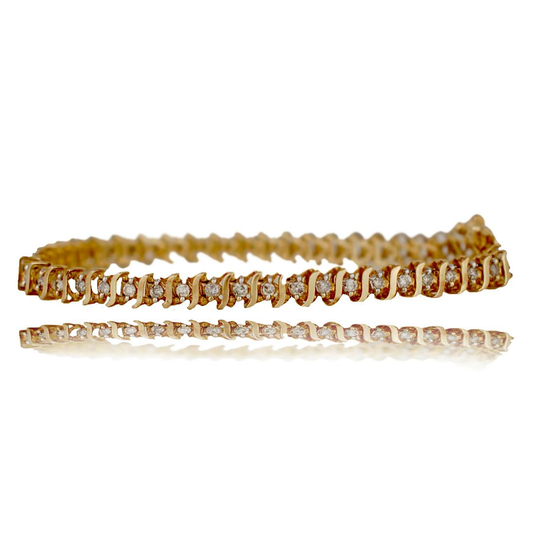 Yellow gold Tennis Bracelet, 1.50 CTW, Channel: Yellow gold Tennis Bracelet, 1.50 CTW, Channel14 karat yellow gold tennis bracelet features, brilliant cut round (47) diamonds measuring 1.9 mm each with a total estimated weight of 1.50 carat.Measure