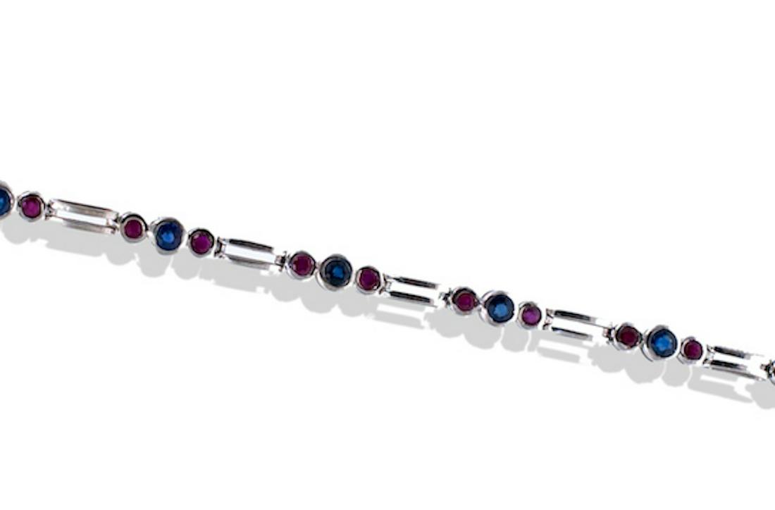 Sapphire and Ruby, Tennis 1.50 TCW Bracelet, Bezel Set: Sapphire and Ruby, Tennis 1.50 TCW Bracelet, Bezel Set 14 Karat Gold7 inches in length tennis bracelet with alternating Sapphires and Rubies. (9) round shaped sapphires measuring 3 mm each with a tota