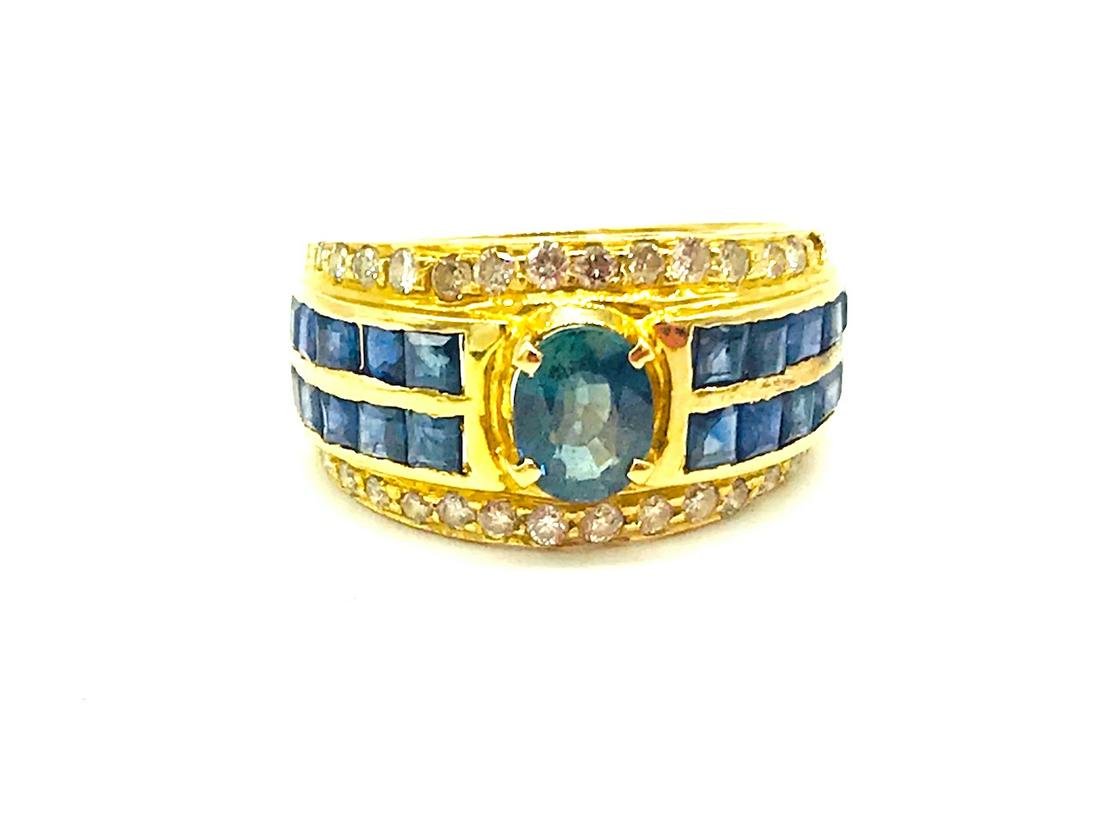 Natural Sapphire and Diamond, 2.25 CTW Ring, 18 Kt: Sapphire and Diamond 18 Kt Solitaire Ring Oval center sapphire measures 6.20-5.02 x 2.55 weighing estimated .75 carat. Color is blue and consistent with quality gemstone. (20) princess-cut sapphires, 