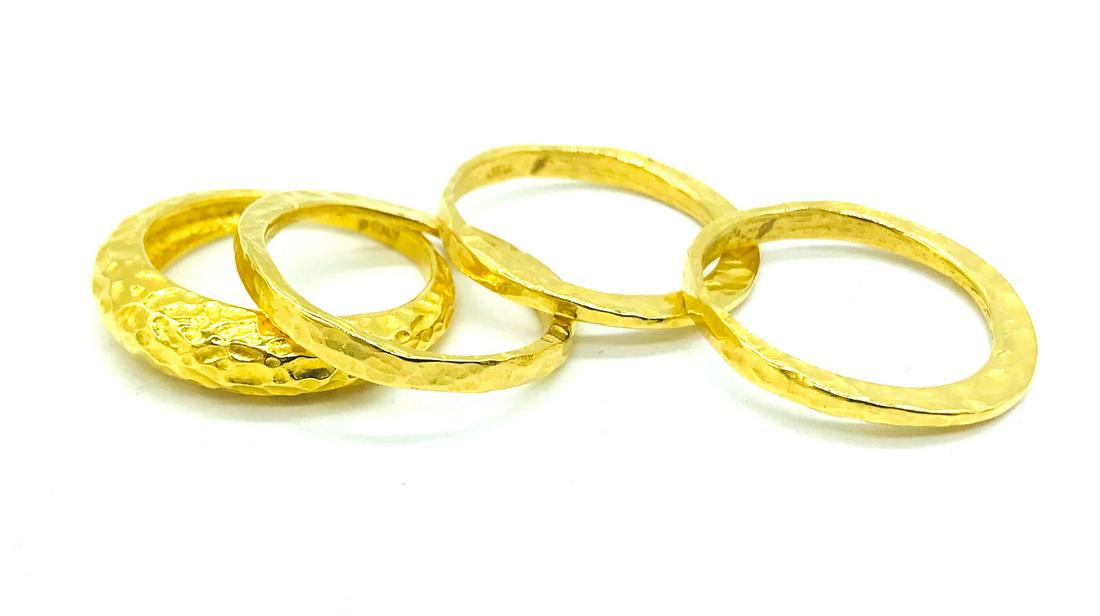 4 Stackable Italian, Hammered Yellow Gold, Rings: 4 Stackable, Hammered Yellow Gold, Italian Rings Ring size 9. Weight is 8..5 grams. Made in Italy. Total 10.25 mm wide. Yellow gold electroplated over unmarked base and most likely brass. GIA Gemologi