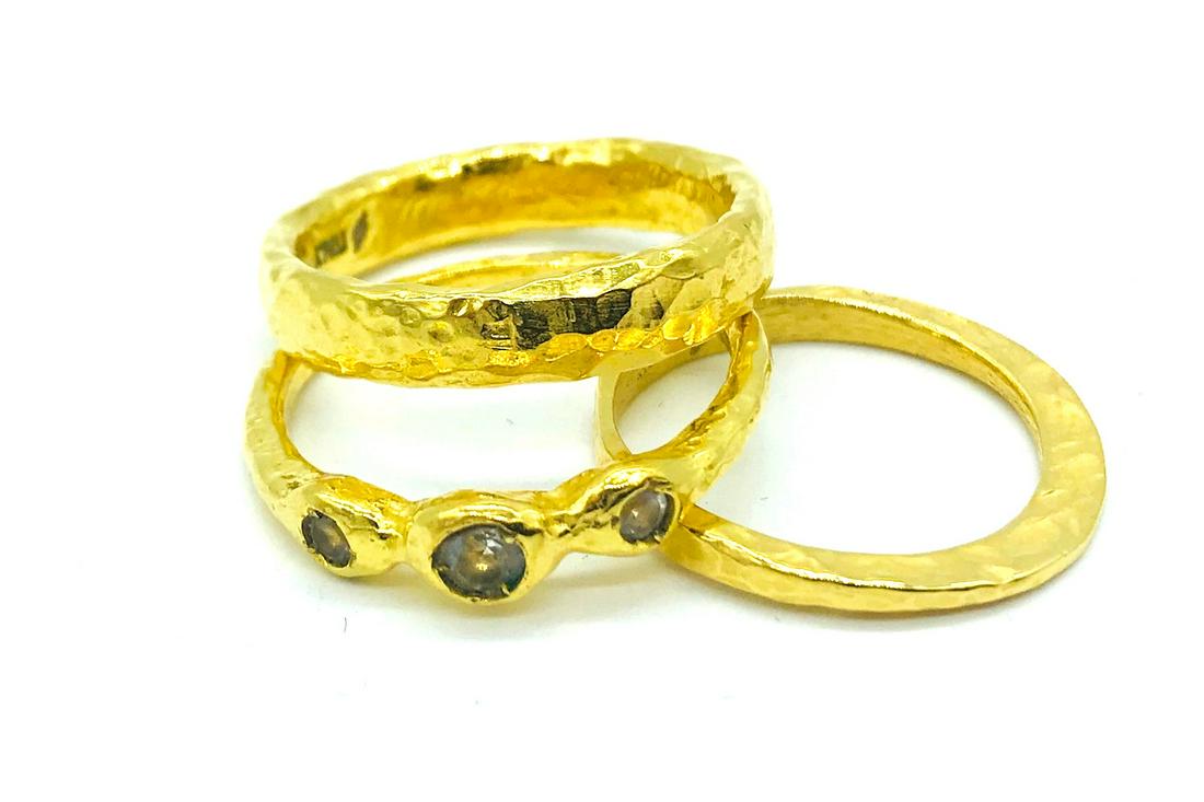 3 Stackable rings, Cubic Zerconia Hamered Style, Yellow: 3 Stackable, Hammered Yellow CZ Gold, Italian Rings Ring size 9 (thinnest one) others are size 11. Weight is 10.0 grams. Made in Italy. Total 11.44 mm wide. 3-stone Cubic Zerconia Yellow gold electrop