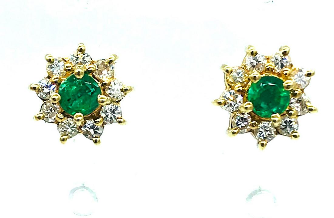 Sparkling, Emerald Diamond Cluster Earrings: Sparkling, Emerald Diamond Cluster Earrings 14kt. Yellow gold diamond cluster earrings. Center consists of brilliant 3.60 mm Columbian Emerald, .40 Carat and natural. Diamonds are (20) total 1.30 mm w