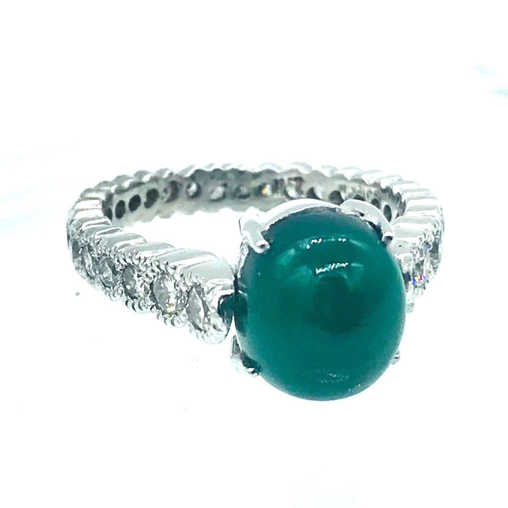 Green Jade, Eternity Platinum 1.50 Ct. Diamond Ring: Green Jade, Eternity Platinum Diamond Ring Jade is a cabochon measuring 9.85 mm x 8.67 mm and set on an eternity diamond setting. (29) round diamonds set in tube style with migraine edging encompass t