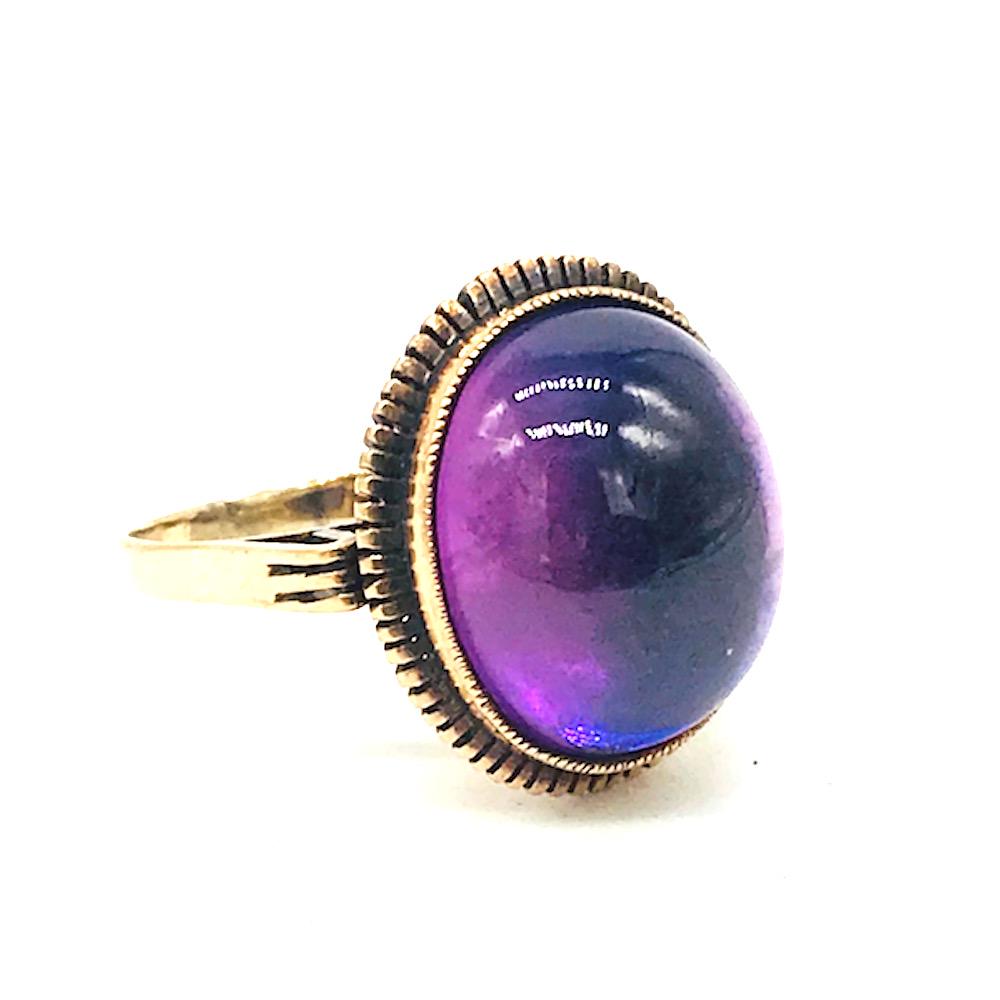 Victorian, Purple Stone, 18 kt Pink Gold Ring: Victorian, Purple Stone, 18 kt Pink Gold Ring Face of ring is large 17 mm long bezel set purple stone set in pink gold. Detailed casing of beautiful lines underneath cradle of stone. Finger size is 6.