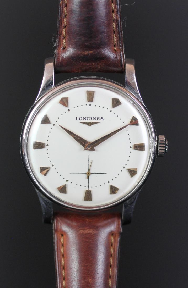 GENTLEMEN'S LONGINES DRESS WATCH, CIRCA. 1953 MANUALLY: GENTLEMEN'S LONGINES DRESS WATCH, CIRCA. 1953 MANUALLY WOUND WRISTWATCH, circular white dial with gold tone sword hands, subsidiary seconds with gold tone second hand, inner minute track with fancy go