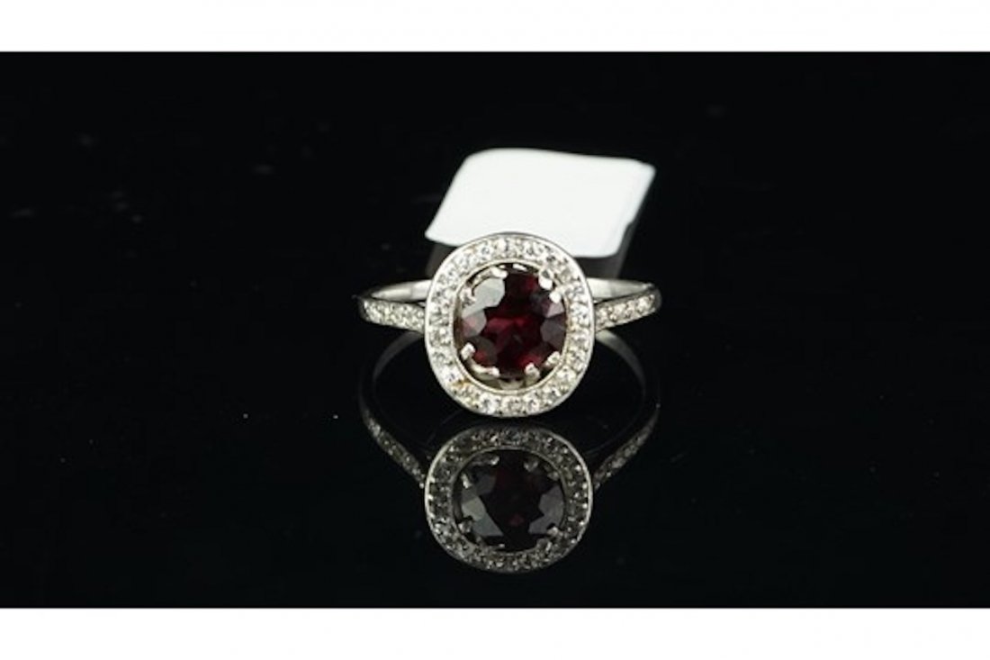 Garnet and diamond cluster ring, central oval cut (1 of 2)