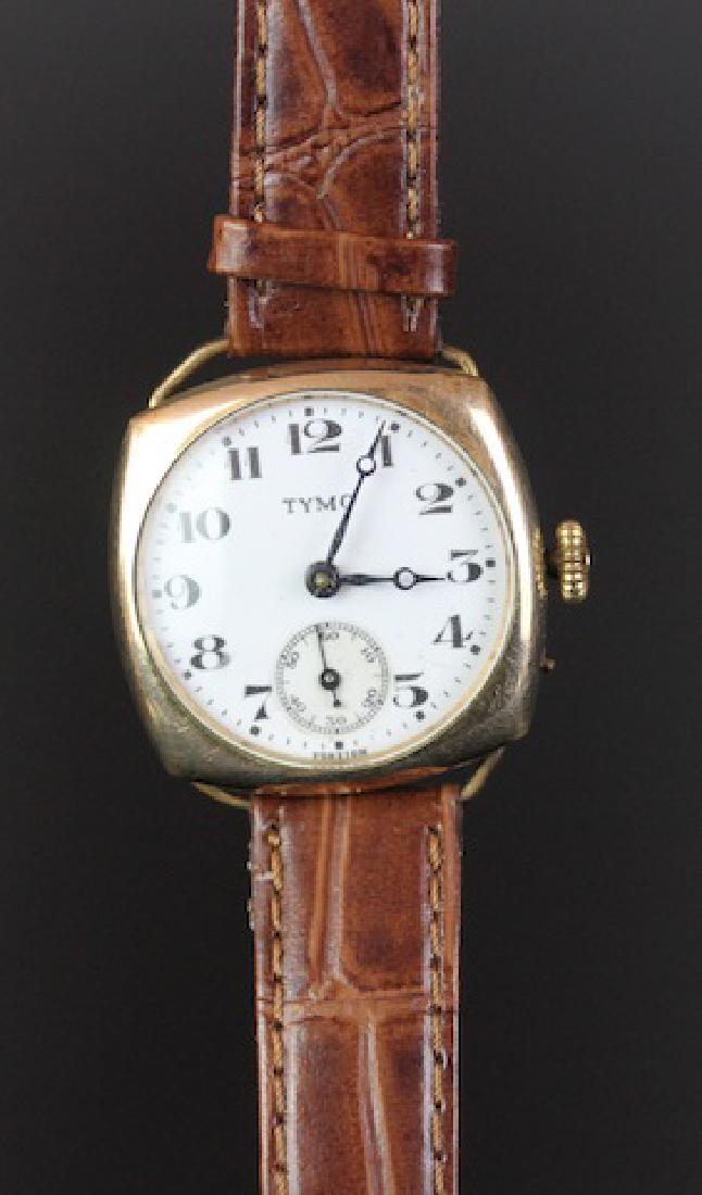 GENTLEMEN'S TYMO ROLLED GOLD CUSHION CASE, MANUALLY: GENTLEMEN'S TYMO ROLLED GOLD CUSHION CASE, MANUALLY WOUND WRISTWATCH, circular white dial with Breguet style blued hands, bold numerals around edge of dial with black minute track, bold Tymo logo at 1