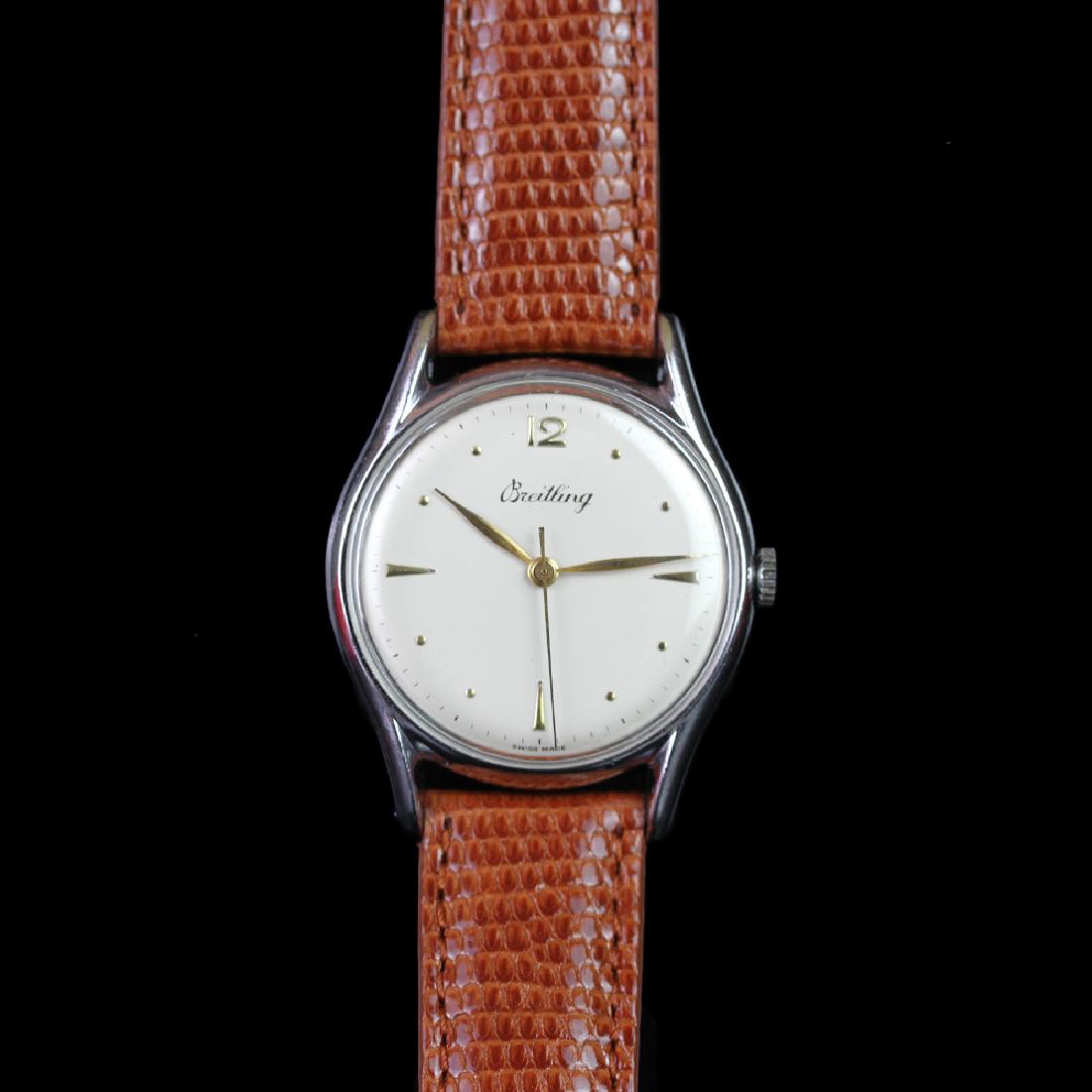 GENTLEMEN'S BREITLING DRESS WATCH, CIRCA. 1953, CAL.: GENTLEMEN'S BREITLING DRESS WATCH, CIRCA. 1953, CAL. 1147, VINTAGE MANUALLY WOUND WRISTWATCH, circular white dial with gold tone leaf hands, gold tone central second hand, applied gold tone indices wi