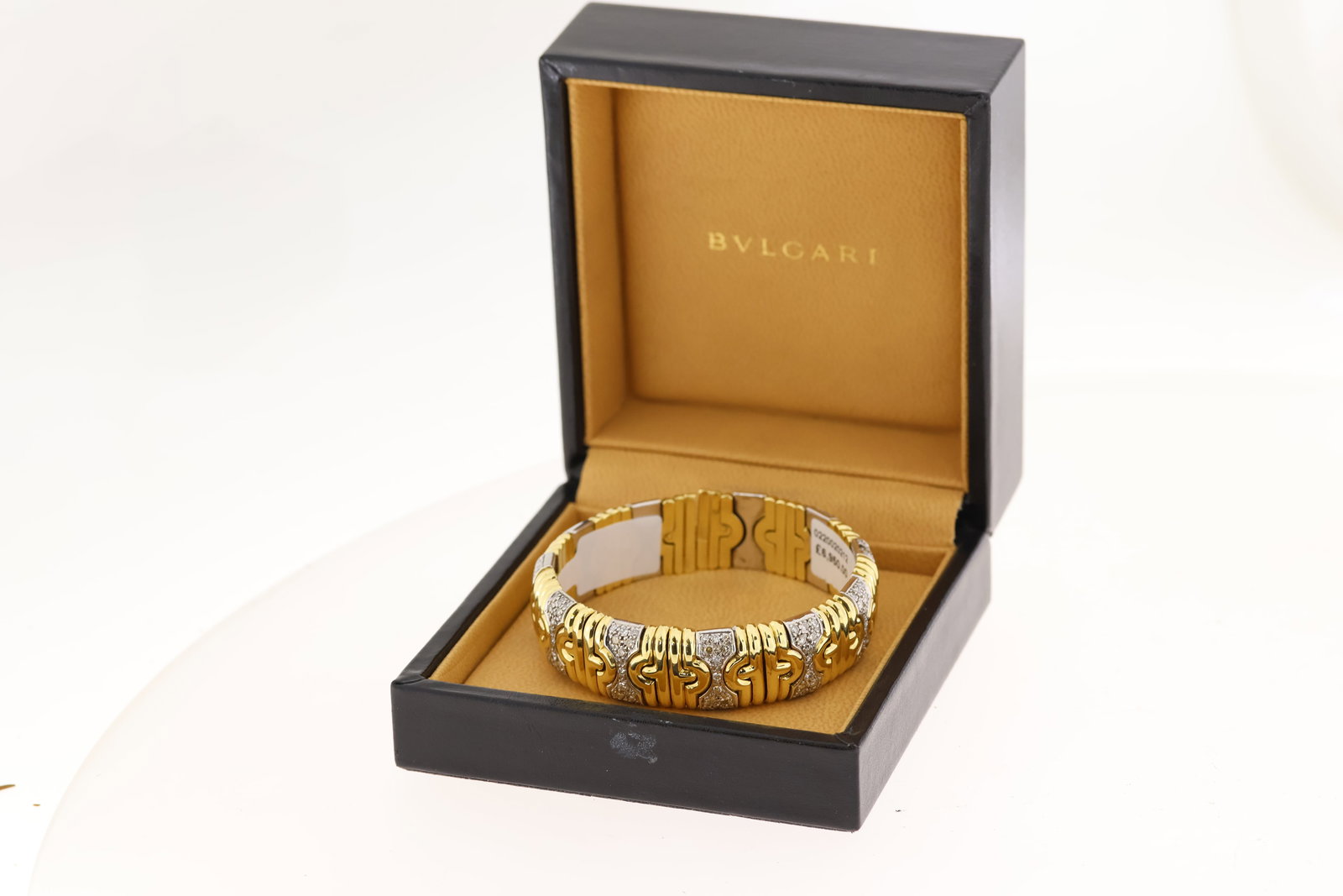 18ct yellow and white gold diamond set Bulgari bangle. Flexible torque style with diamond set (1 of 3)