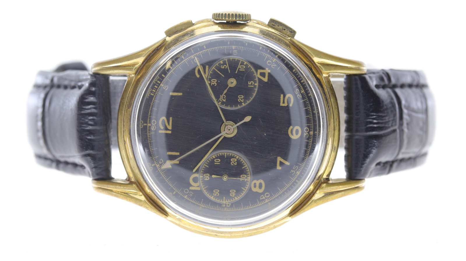 Vintage Chronograph Sterile Dial Circa 1970's: Vintage Chronograph Sterile Dial Circa 1970's, circular black dial with arabic numerals, two subsidiary dials, black leather strap, gold plated, 37mm, currently running.