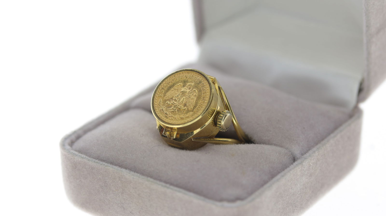 Rare EMKA 18ct Gold Ring Watch with a 22ct Mexican Dos Pesos Coin: Rare EMKA 18ct Gold Ring Watch with a 22ct Mexican Dos Pesos Coin, sold on the Maiden Voyage of RMS Queen Elizabeth II QE2, purchase receipt, total approximate weight, 10.5g. Watch is currently runnin