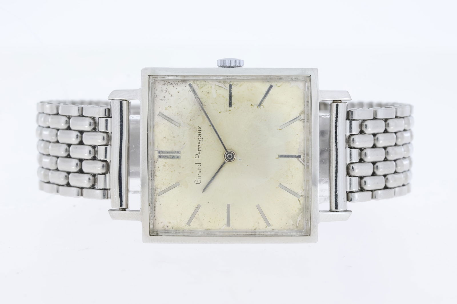 Vintage Girard Perregaux Manual Wind: Brand: Vintage Girard Perregaux Movement: Manual Wind Dial shape: Square Dial colour: Silver patina Case size: 29mm Case material: Stainless steel Case back: Snap on Bracelet or strap: Bracelet Bracel