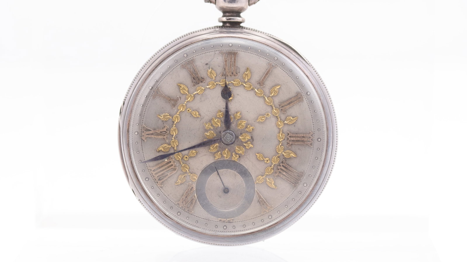 A Verge Silver Pocket Watch, Harris Wise & Co: A Verge Silver Pocket Watch, Harris Wise & Co, Manchester,silver dial with gilt Roman numerals and floral detail, sub seconds dial, 53mm diameter, inner cover engraved ' Willm L. Balshaw 1873' hallmar