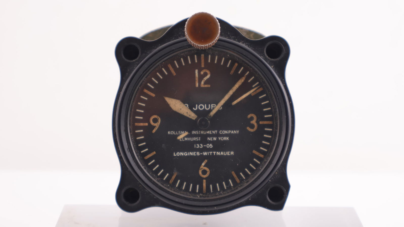 A Rare Longines-Wittnauer 8 Days Instrument Cockpit Clock from C.1940's: A Rare Longines-Wittnauer 8 Days Instrument Cockpit Clock from C.1940's, 60mm in diameter, featured on the dial 'Kollsman Instrument Company', ' Elmhurst New York' '133-05'. Comes with the backing pla