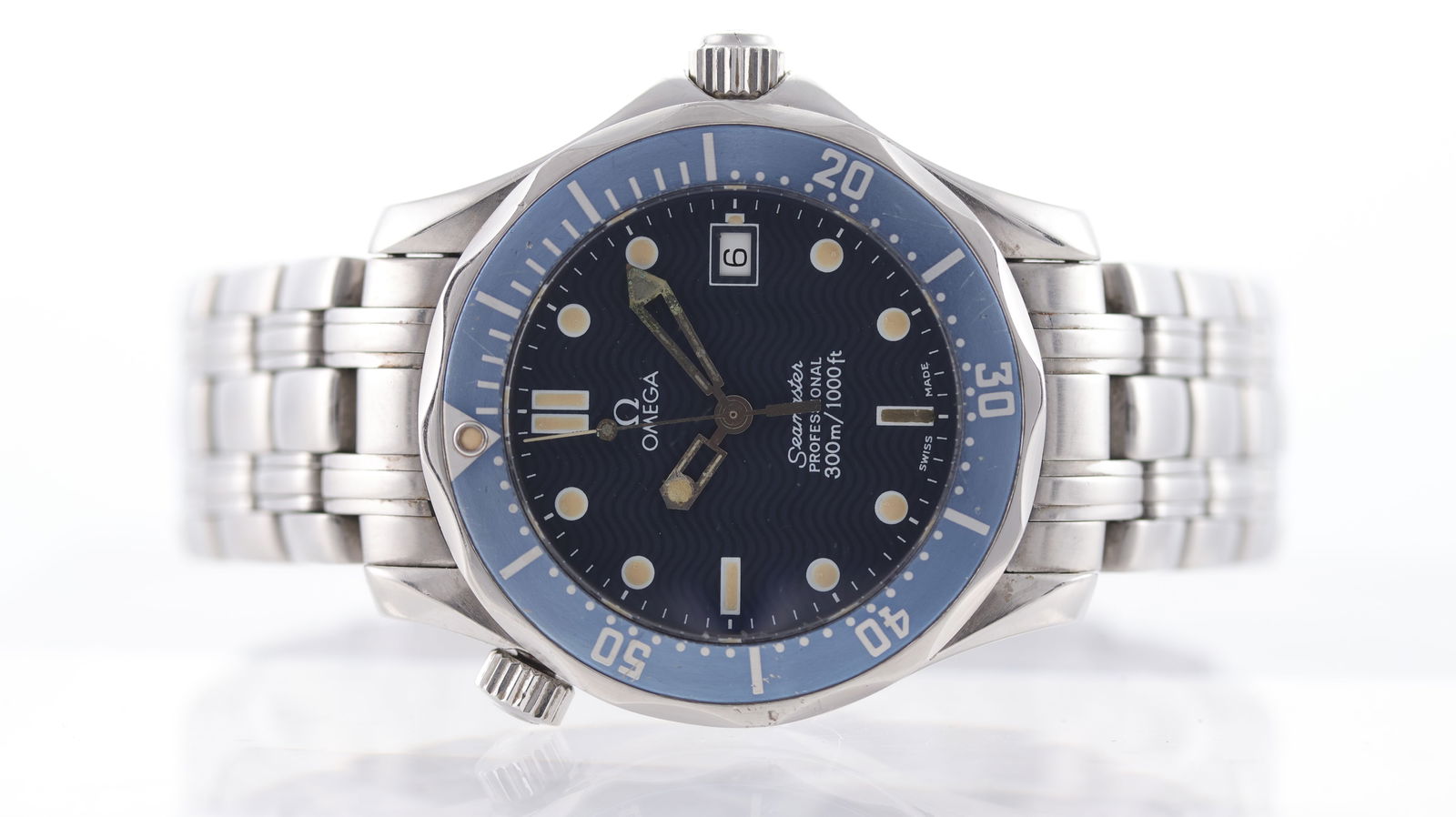 Omega Seamaster Mid Size Date Quartz Circa 1990's: Brand: Omega Model Name: Seamaster Mid Size Movement: Quartz Year: Circa 1990's Dial shape: Circular Dial colour: Blue Dial features: Wave dial with dot hour markers, quickset date at 3 o'clock Bezel: