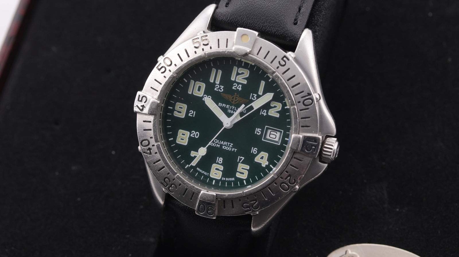 Breitling Colt Date Quartz with Box and Papers 1998: Brand: Breitling Model Name: Colt Reference: A57035 Movement: Quartz Year: 1998 Box: Full Box Papers: Full Set Papers Dial shape: Circular Dial colour: Green Dial features: Luminos Arabic numerals, in