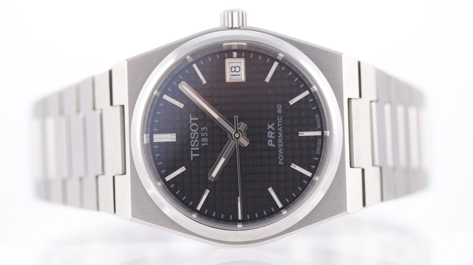 Tissot Prx Date Automatic: Brand: Tissot Model Name: Prx Reference: T137207A Movement: Automatic Movement calibre: Powermatic 80 Dial shape: Circular Dial colour: Black Dial features: Waffle textured dial with applied silver ba