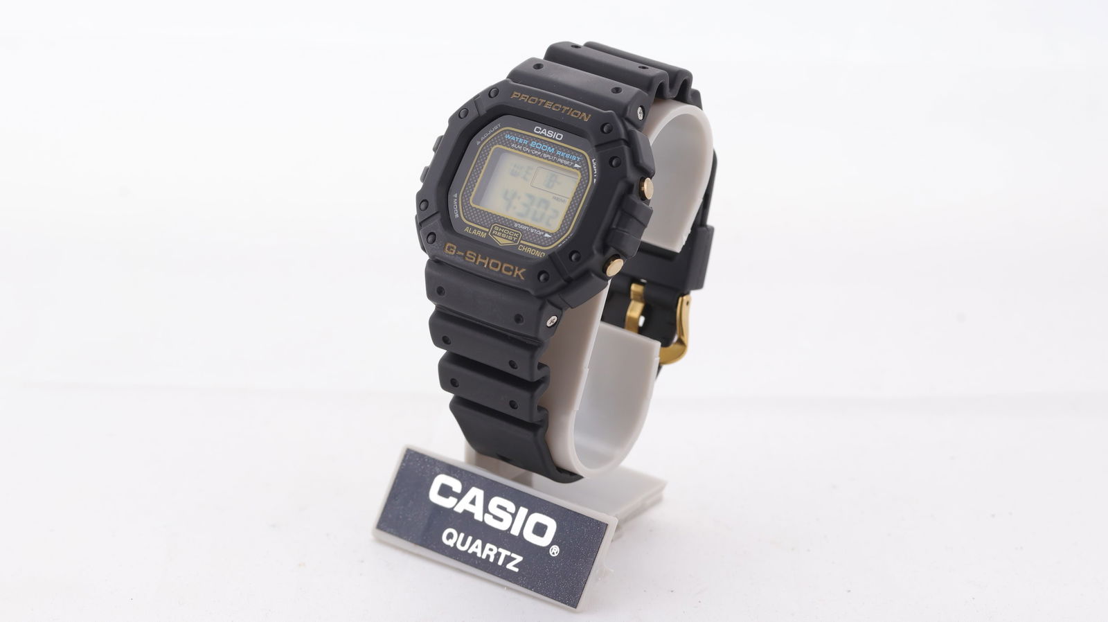 N.O.S Casio G-Shock Ref DW-5300 with Box and Papers 1996: Brand: Casio Model Name: G-Shock Reference: DW-5300 Movement type: Quartz Year: 1996 Box: Inner and outer box Papers: Associated Papers Dial shape: Circular Dial colour: Black/Grey Dial