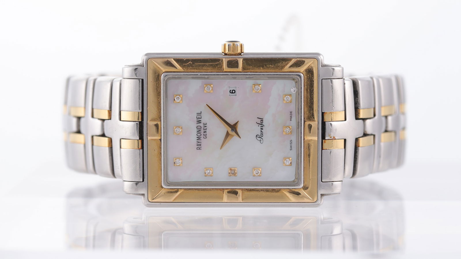 Raymond Weil Parsifal Ref 9330: Brand: Raymond Weil Model Name: Parsifal Reference: 9330 Movement type: Quartz Dial shape: Rectangular Dial colour: Mother of Pearl Dial features: Gold hands with stone set hour markers. Date
