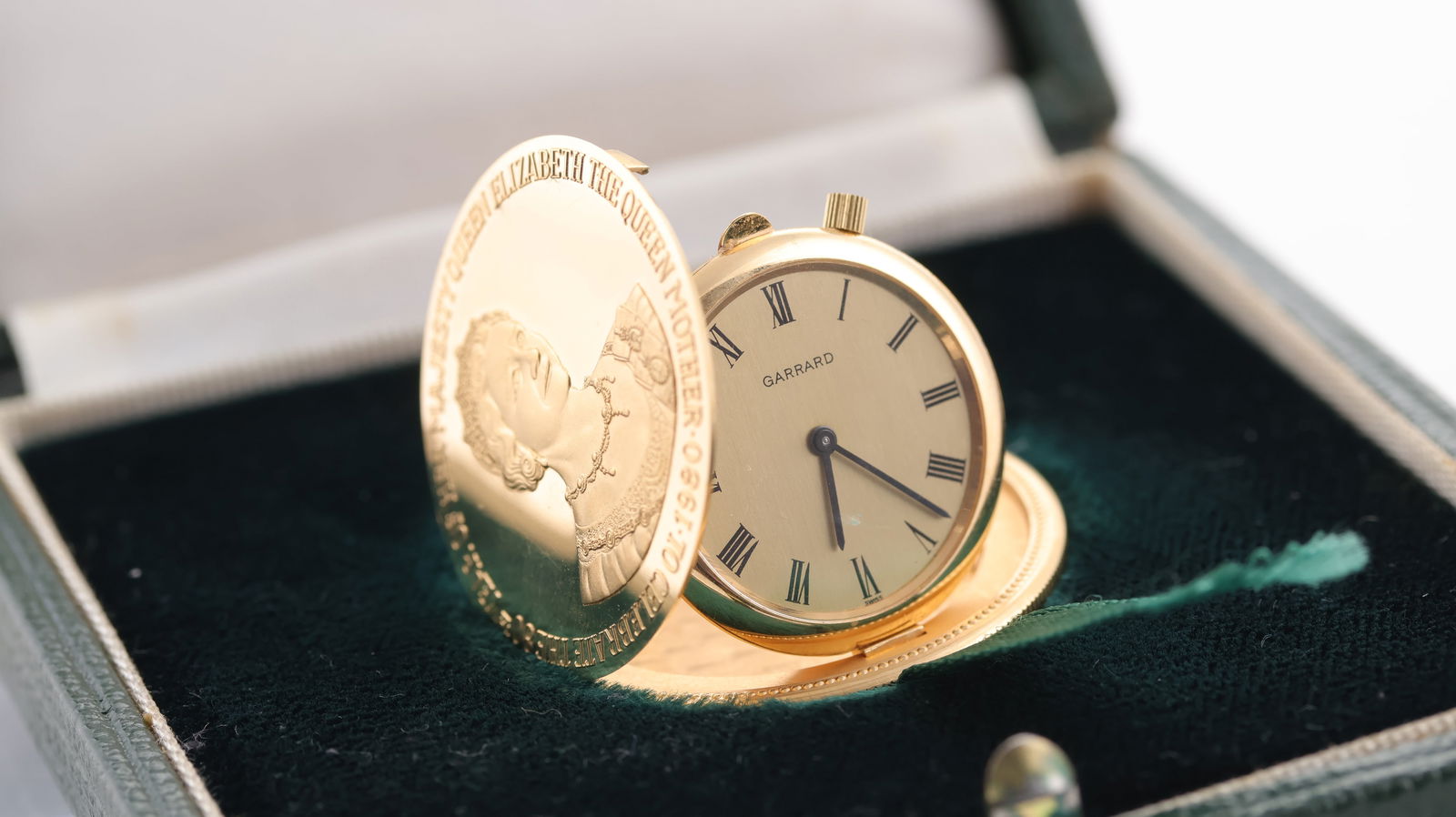 18ct Garrard Limited Edition Coin Watch to Commemorate the 80th Birthday of the Late Queen Mother: 18ct Garrard Limited Edition Coin Watch to Commemorate the 80th Birthday of the Late Queen Mother, limited edition number 21 of 80, concealed manual wind movement, 34mm case, currently running with th