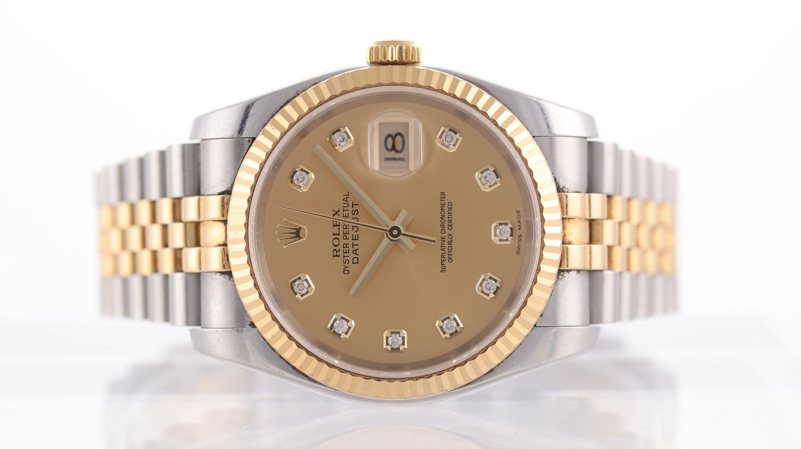 Rolex Datejust 36 Steel and Gold Ref 116233 Circa 2006: Brand: Rolex Model Name: Datejust 36 Reference: 116233 Movement type: Automatic Movement calibre: Rolex 3135 Year: Circa 2006 Dial shape: Circular Dial colour: Champagne Dial features: Diamond dot hou
