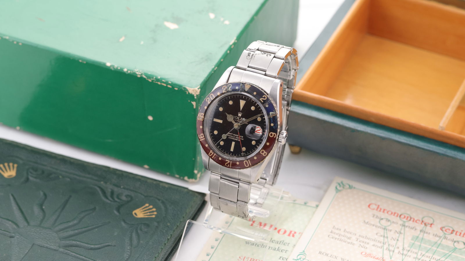 Vintage Rolex GMT Master Ref 6542 'Pepsi' Tropical Dial with Box and Papers 1957: Brand: Rolex Model Name: GMT Master Reference: 6542 Movement type: Automatic Movement calibre: Rolex 1065 Year: 1957 Box: Full Box Dial shape: Circular Dial colour: Black Tropical Dial features: Tropi