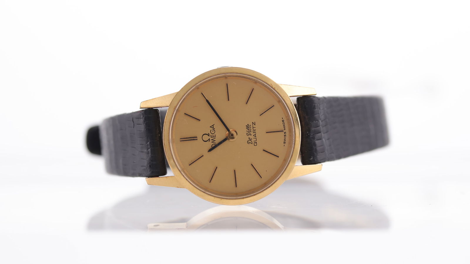 Ladies Omega De Ville Ref 1350 with Box: Brand: Omega Model Name: De Ville Movement type: Quartz Box: inner box Dial shape: Circular Dial colour: Champagne Dial features: Applied baton hour markers. Case size: 20mm Case material: Gold plated
