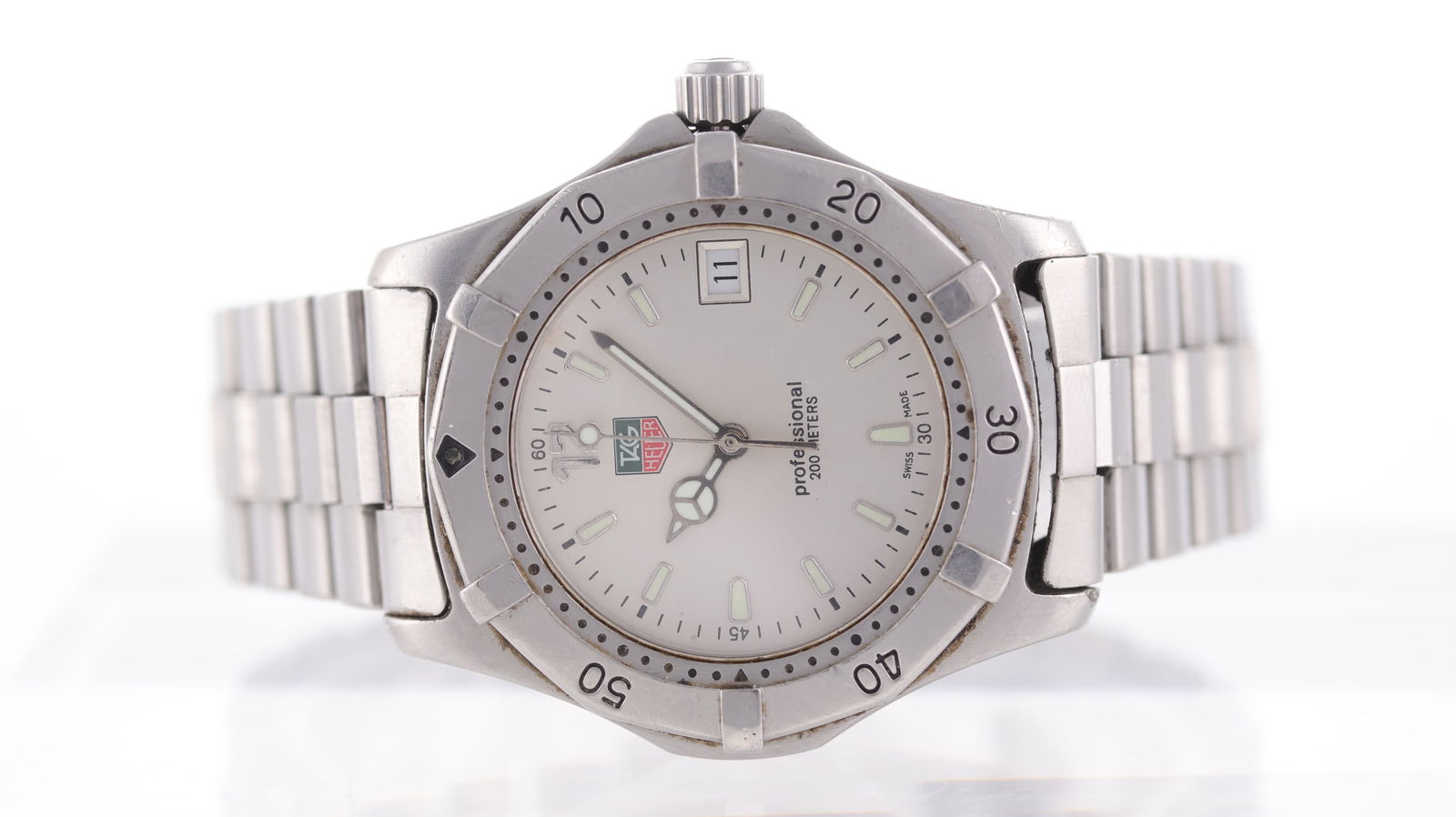 Tag Heuer Professional 2000 Ref WK1120-0: Brand: Tag Heuer Model Name: Professional 2000 Reference: WK1120-0 Movement type: Quartz Dial shape: Circular Dial colour: Silver Dial features: Lume hands and hour markers. Mercedes hour hand. Date a