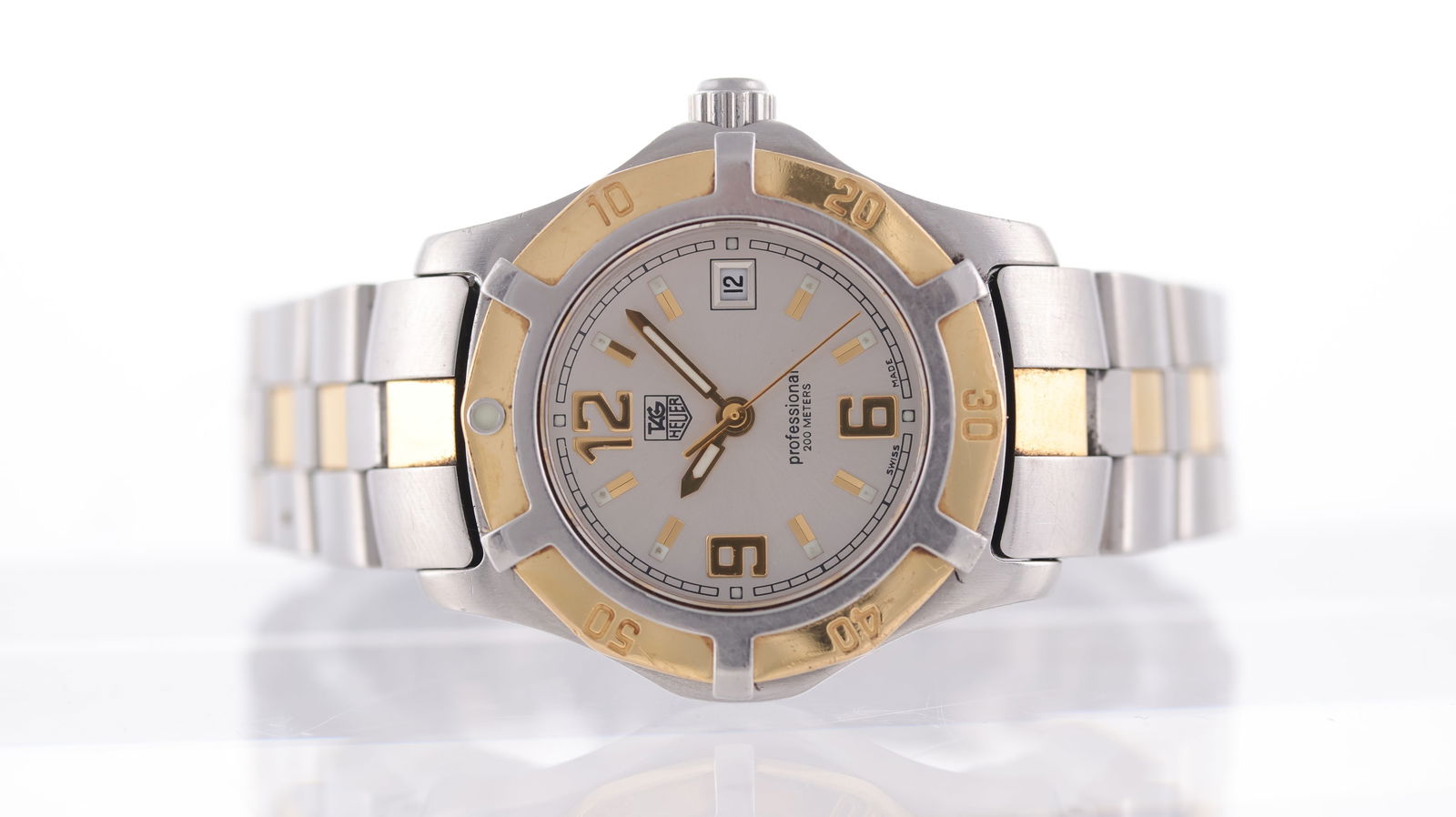 Tag Heuer 2000 Exclusive Ref WN1353-0: Brand: Tag Heuer Model Name: 2000 Exclusive Reference: WN1353-0 Movement type: Quartz Dial shape: Circular Dial colour: Sunburst, Silver Dial features: Applied baton and arabic numeral hour markers. Q