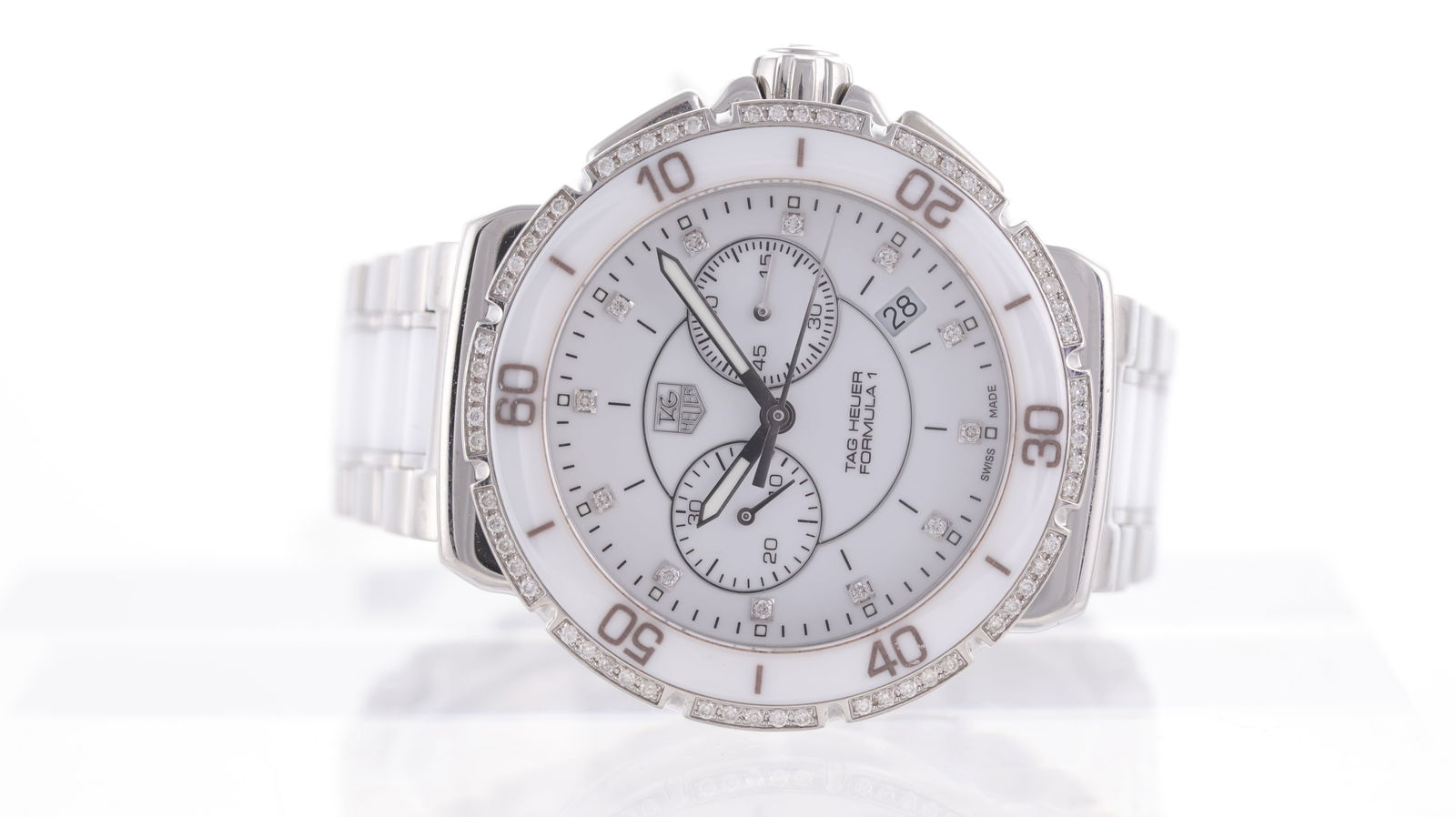 Tag Heuer Formula 1 Ref CAH1213: Brand: Tag Heuer Model Name: Formula 1 Reference: CAH1213 Movement type: Quartz Dial shape: Circular Dial colour: White Dial features: Stone set hour markers. Date aperture at 3:30 o'clock. Bezel: Fix