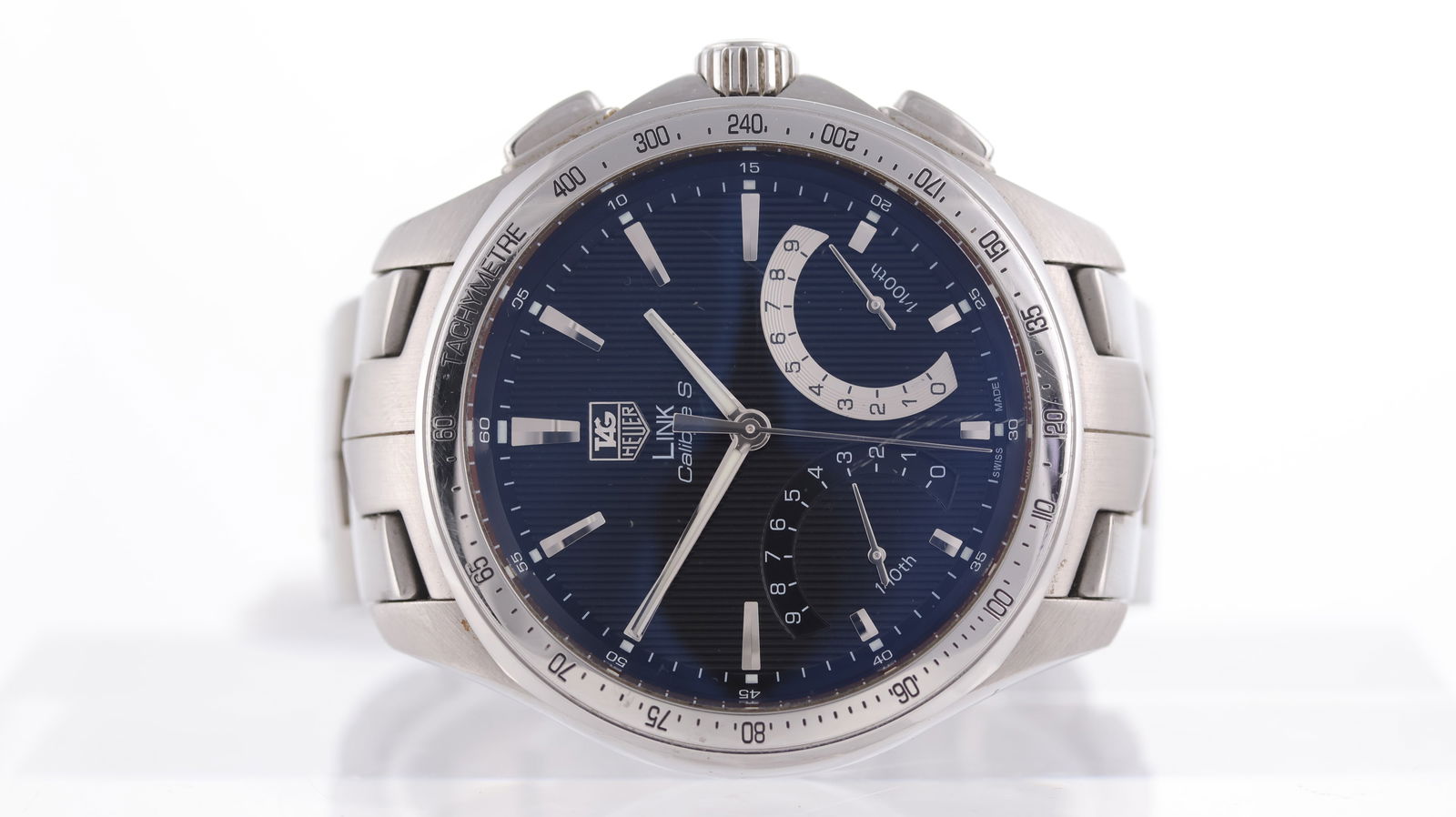 Tag Heuer Link Calibre S Ref CAT7010: Brand: Tag Heuer Model Name: Link Calibre S Reference: CAT7010 Movement type: Quartz Dial shape: Circular Dial colour: Black Dial features: Block hour markers, two sub counters for 1/10 and 1/100 spli