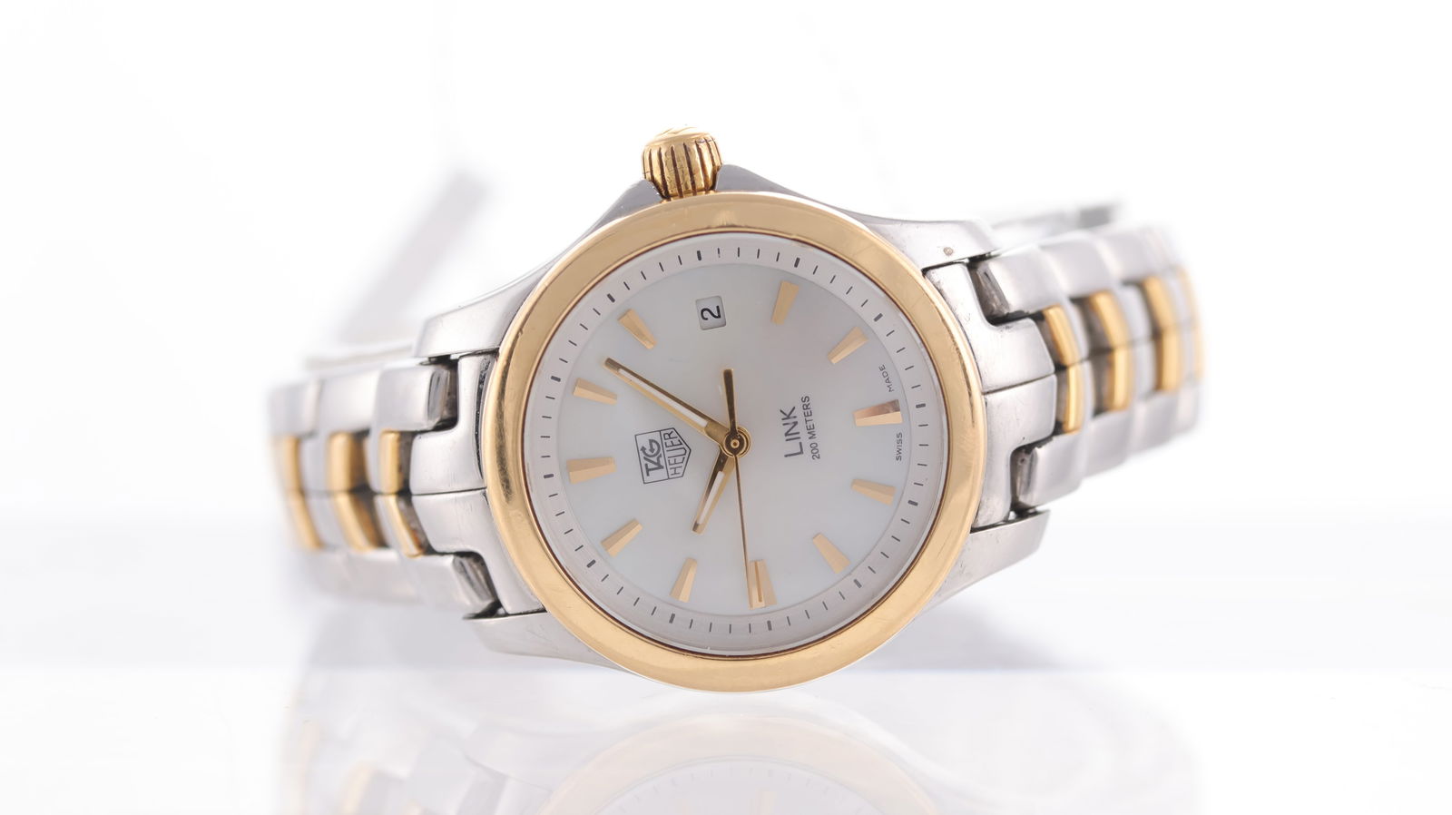 Tag Heuer Link Ref WJF1352: Brand: Tag Heuer Model Name: Link Reference: WJF1352 Movement type: Quartz Dial shape: Circular Dial colour: Mother of pearl Dial features: baton hour markers, date aperture at 3 o'clock Bezel: gold p