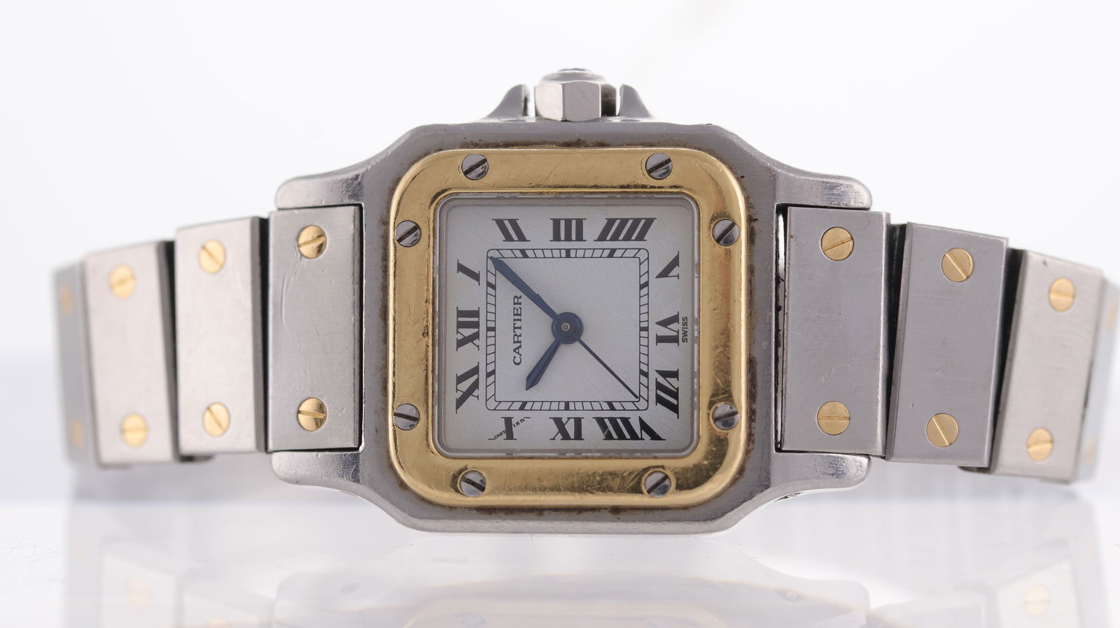 Cartier Santos Carree Ref 0902: Brand: Cartier Model Name: Santos Carree Reference: 0902 Movement type: Automatic Dial shape: Square Dial colour: white Dial features: Roman numerals, center seconds Bezel: 18ct yellow gold Case size: