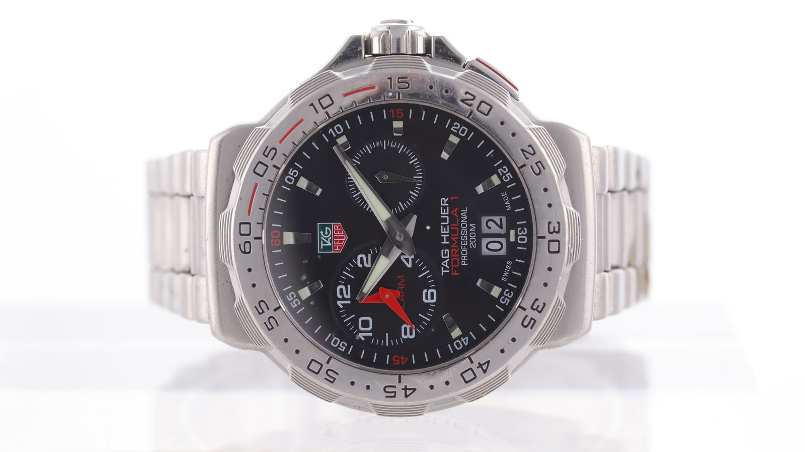 Tag Heuer Formula 1 Alarm Ref WAH111C: Brand: Tag Heuer Model Name: Formula 1 Alarm Reference: WAH111C Movement type: Quartz Dial shape: Circular Dial colour: black Dial features: two sub dials, alarm and seconds Bezel: rotating outer bexe
